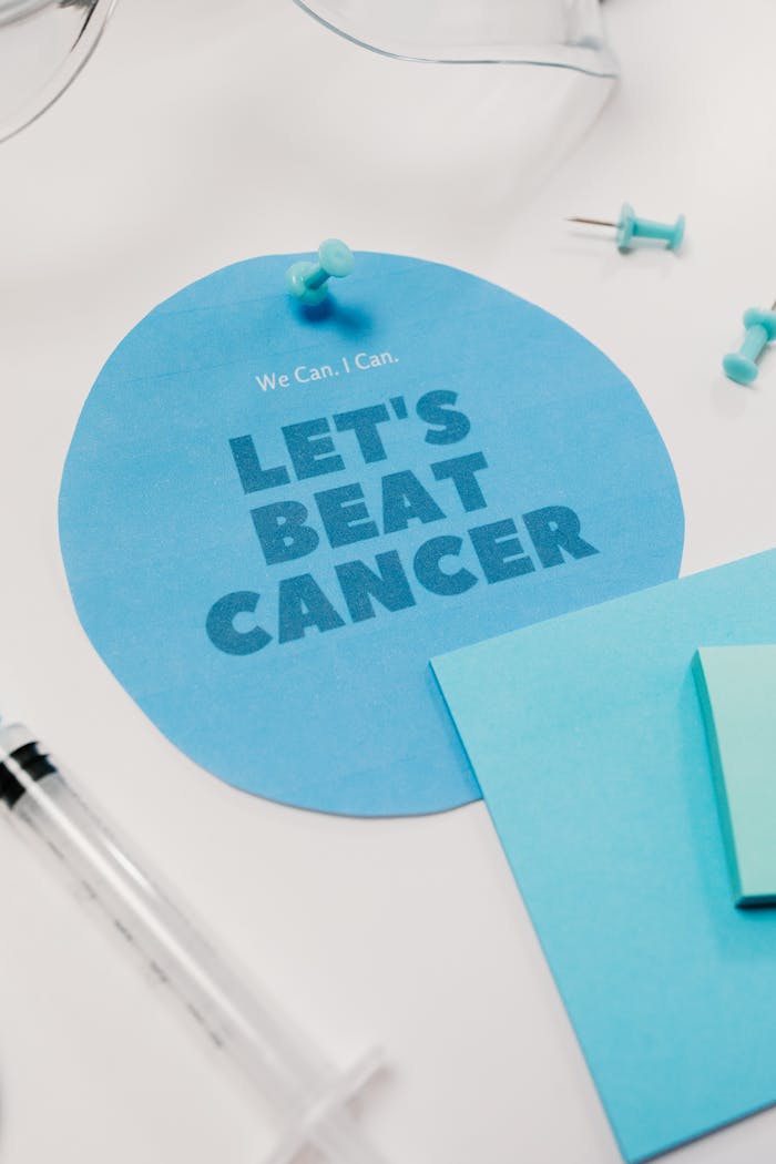 Inspirational 'Let's Beat Cancer' poster with a medical theme.